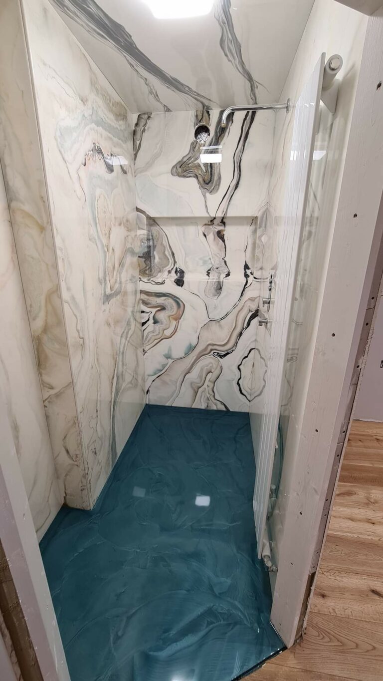 An example of an epoxy resin floor and shower panels, by Home Statements
