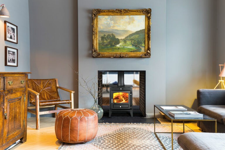 An example of a double sided log burner in a fire place. Home Statements
