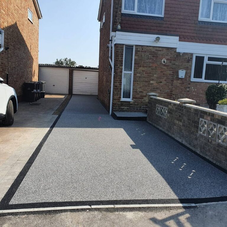 An example of a resin bound driveway with Belgium resin quartz border, installed by Home Statements