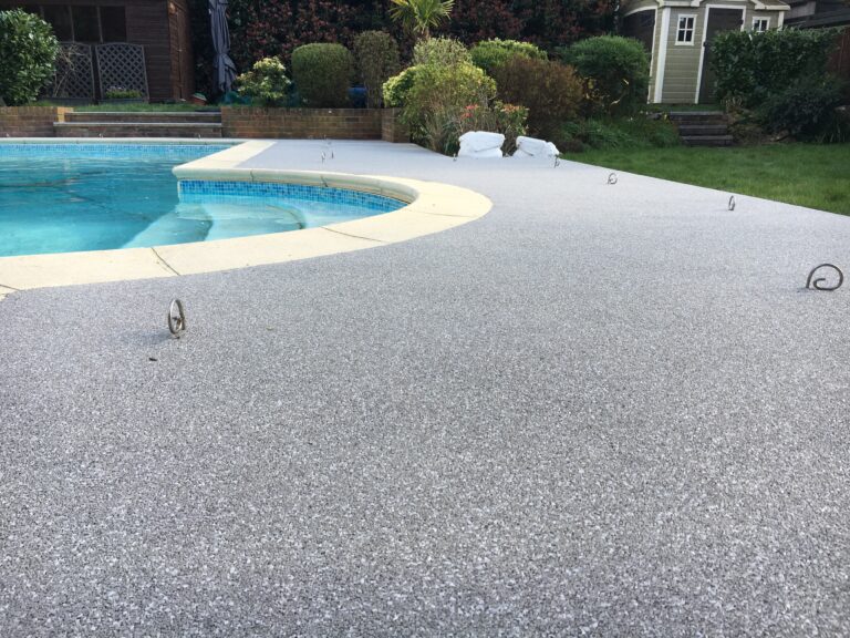 An example of a resin bound swimming pool surround, installed by Home Statements
