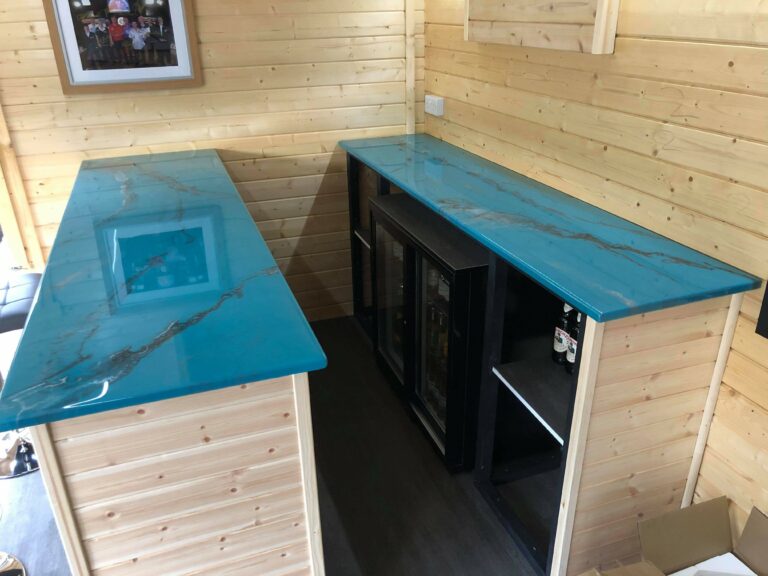 An example of an epoxy resin home bar top in a man cave, created and installed by Home Statements