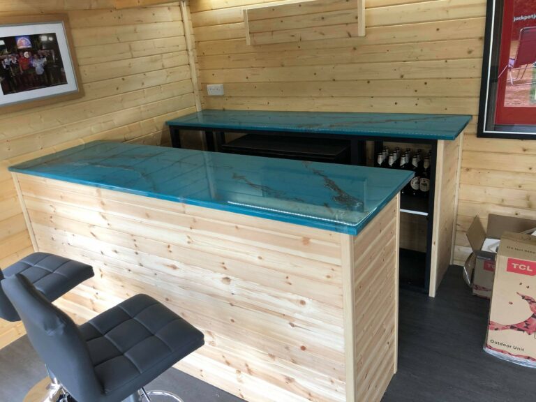 An example of an epoxy resin home bar top in a man cave, created and installed by Home Statements