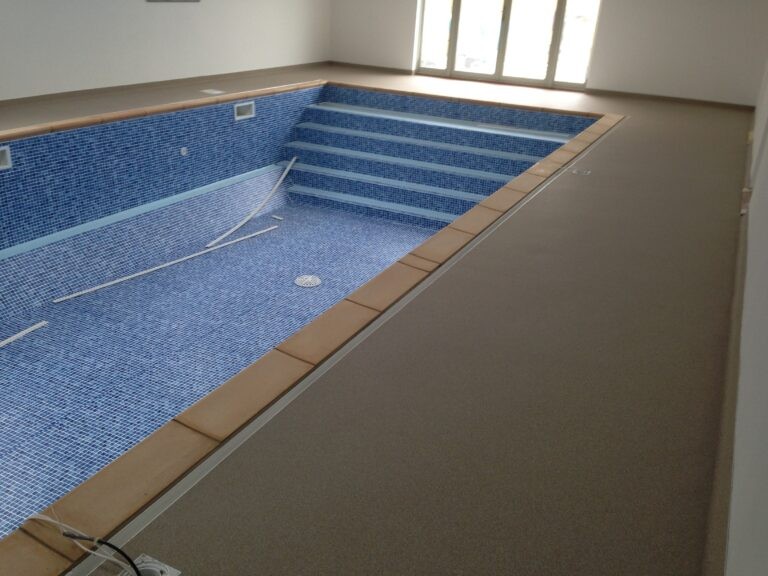 An example of a resin bound swimming pool surround, installed by Home Statemetns