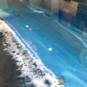 an example of an epoxy resin kitchen splashback in a kitchen by Home Statements