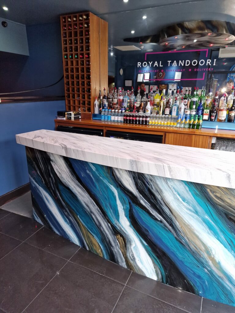 an example of a commercial epoxy resin bar top and front panel in Croydon by Home Statements Ltd